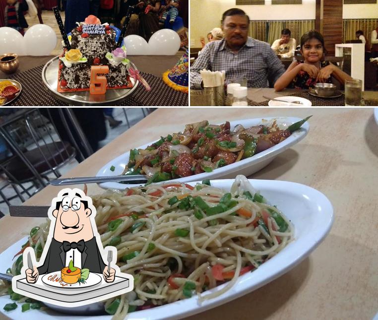 Hari Raj Pure Veg Restaurant is distinguished by food and dining table