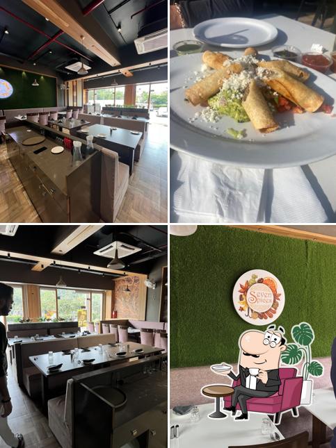 Take a seat at one of the tables at Seven Spices - Multi Cuisine Restaurant