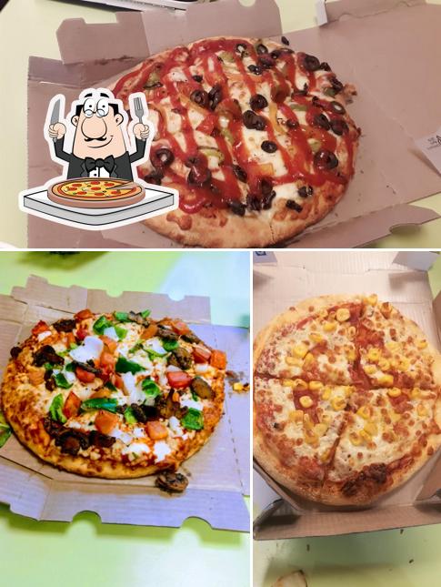 At Domino's Pizza Mahal Bagayat, Vijayapura, you can taste pizza