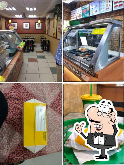 Take a seat at one of the tables at Subway Qutub Plaza
