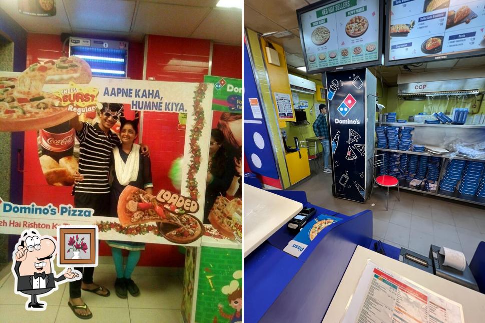 Take a seat at one of the tables at Domino's Pizza Memnagar, Ahmedabad