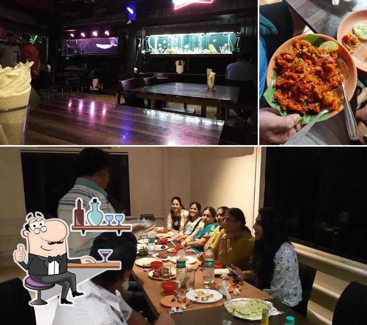 Take a seat at one of the tables at BAJAL BAR AND RESTAURANT