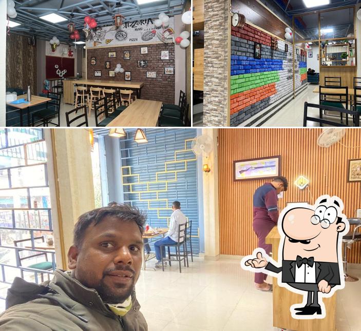 Take a seat at one of the tables at EVERGREEN Pizza & Wrap