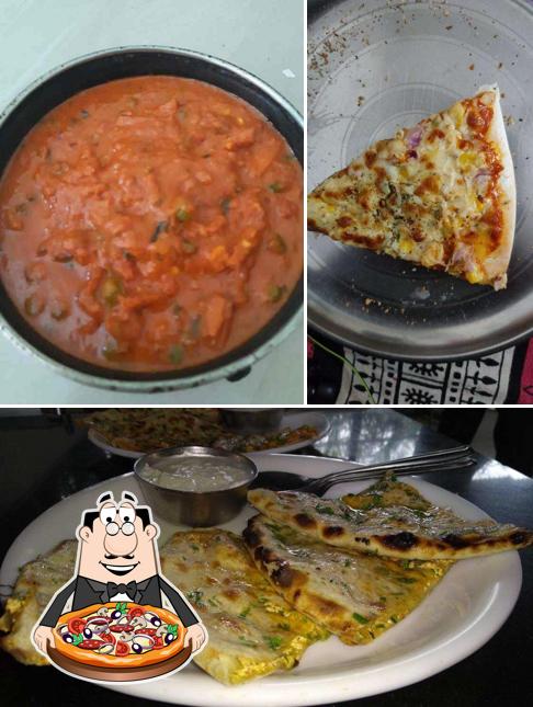Get pizza at Navaratna Veg