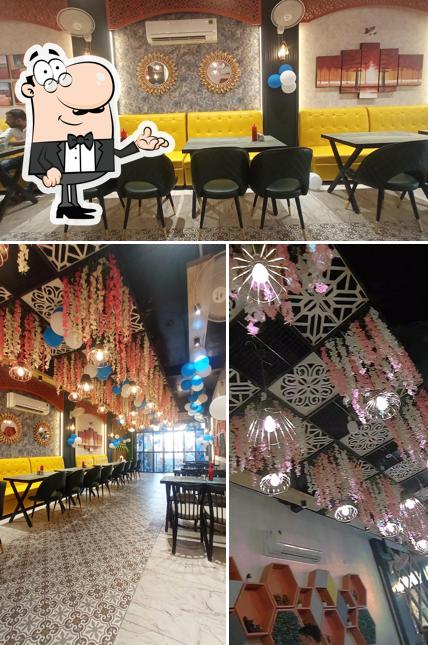 Take a seat at one of the tables at Roms pizza Bulandshahr