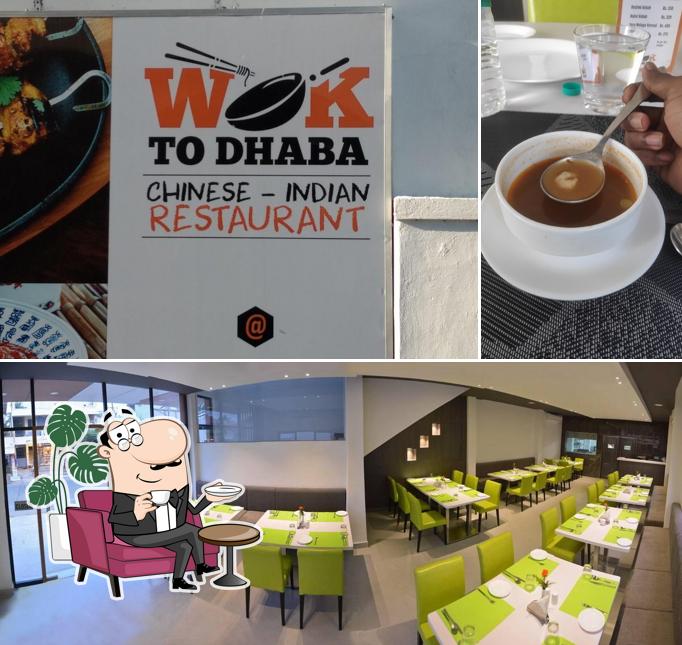 Take a seat at one of the tables at Wok To Dhaba Restaurant