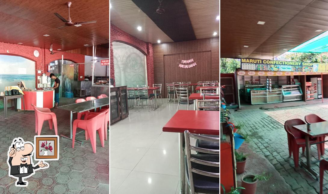Take a seat at one of the tables at Maruti Dhaba