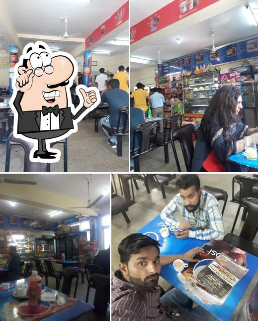 Take a seat at one of the tables at India Coffee House