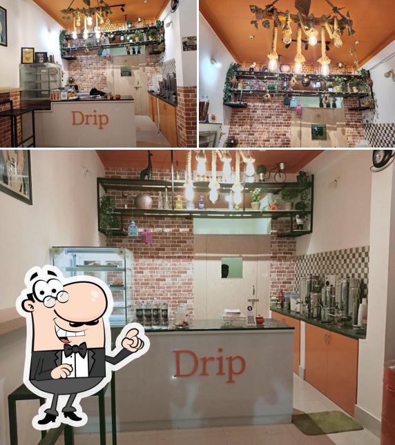 Take a seat at one of the tables at Drip The Cafe Bar
