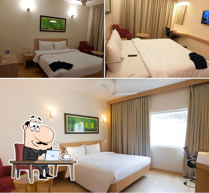 Take a seat at one of the tables at Red Fox by Lemon Tree Hotels, Tiruchirappalli