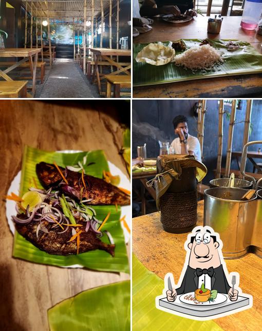 The image of food and interior at Cafe Mango Tree Thekkady(House of Bamboo Biriyani)