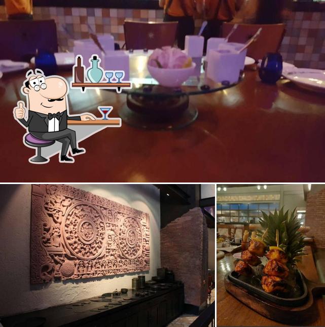 Take a seat at one of the tables at The Great Kabab Factory - Radisson Blu Plaza