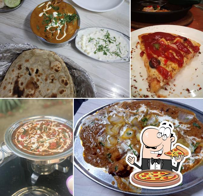 Try out pizza at Tripti Restaurant