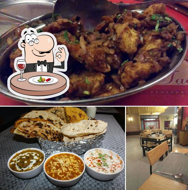 Take a look at the photo displaying food and dining table at Dal Tadkaa