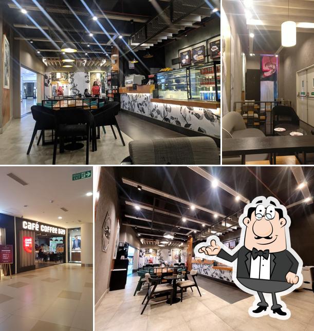 Take a seat at one of the tables at Café Coffee Day