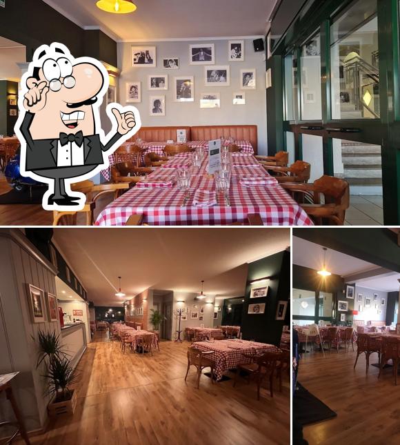 Siediti a un tavolo di Ria Trattoria Pizzeria
