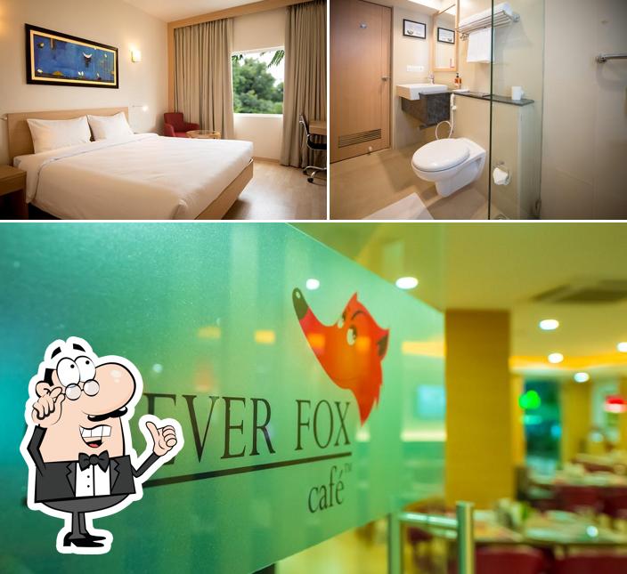 Take a seat at one of the tables at Red Fox by Lemon Tree Hotels, Tiruchirappalli Take a seat at one of the tables at Red Fox by Lemon Tree Hotels, Tiruchirappalli