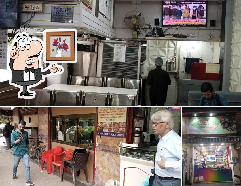 Take a seat at one of the tables at Ayodhya Restaurant