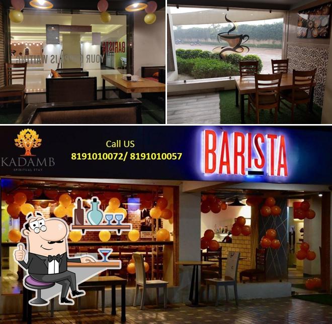 Take a seat at one of the tables at Barista Cafe Vrindavan