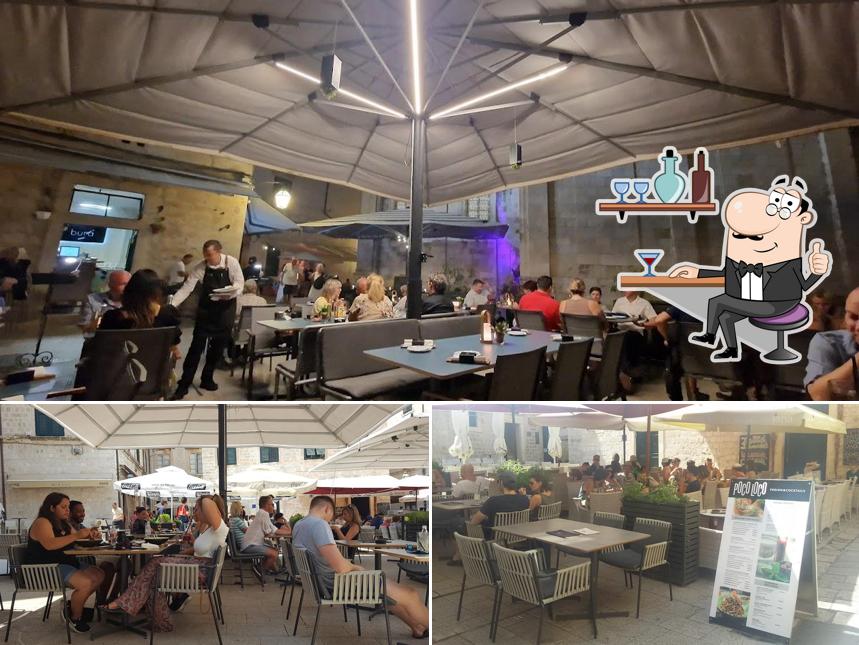 Dai un'occhiata agli interni di Bura Bistro Wine & Cocktails