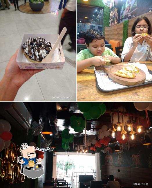 The photo of The New York Pizza’s food and interior