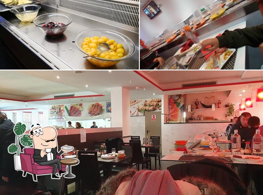 Guarda la foto che mostra la interni e cibo di Wok SUSHI