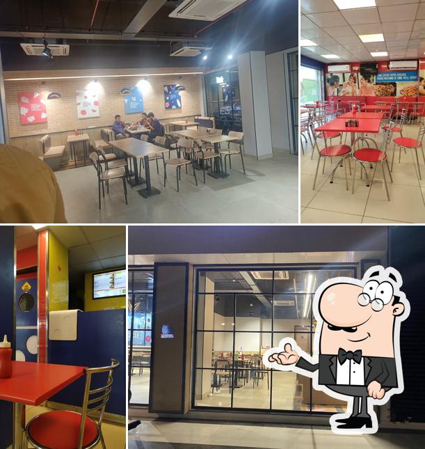 Take a seat at one of the tables at Domino's Pizza Venus Icon, Ankleshwar