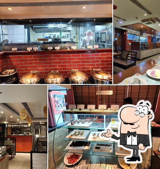 Take a seat at one of the tables at Barbeque Nation