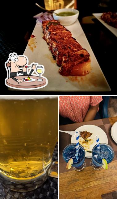The image of food and beer at Oasis Bar & Bistro