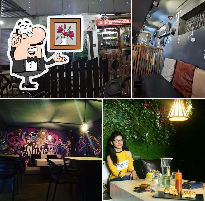 Take a seat at one of the tables at THE CAFE & ROOFTOP -Continental Cafe In Bhandara
