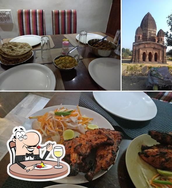 This is the photo depicting food and exterior at Hotel Akash
