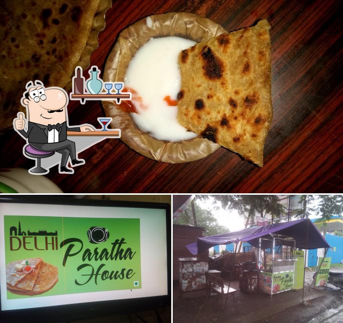 Check out the image depicting interior and food at Delhi Paratha House