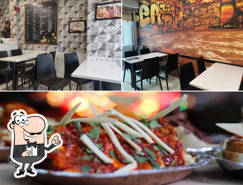 This is the picture depicting interior and food at Shakti Sandwich