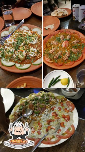 Try out pizza at Gulmohur Restaurant