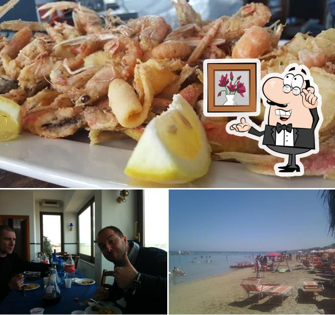 La immagine di interni e cibo da Blumarine Ristorante e Spiaggia