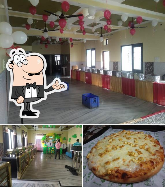 Among various things one can find interior and pizza at The Royal Food Cafe & Restaurant