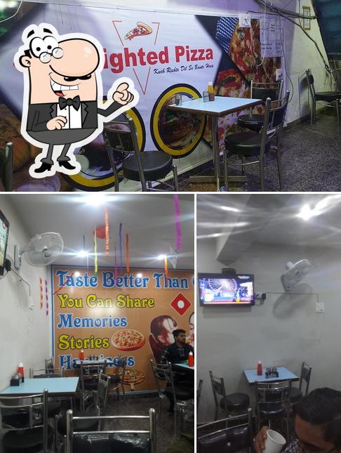 The interior of Delighted Pizza