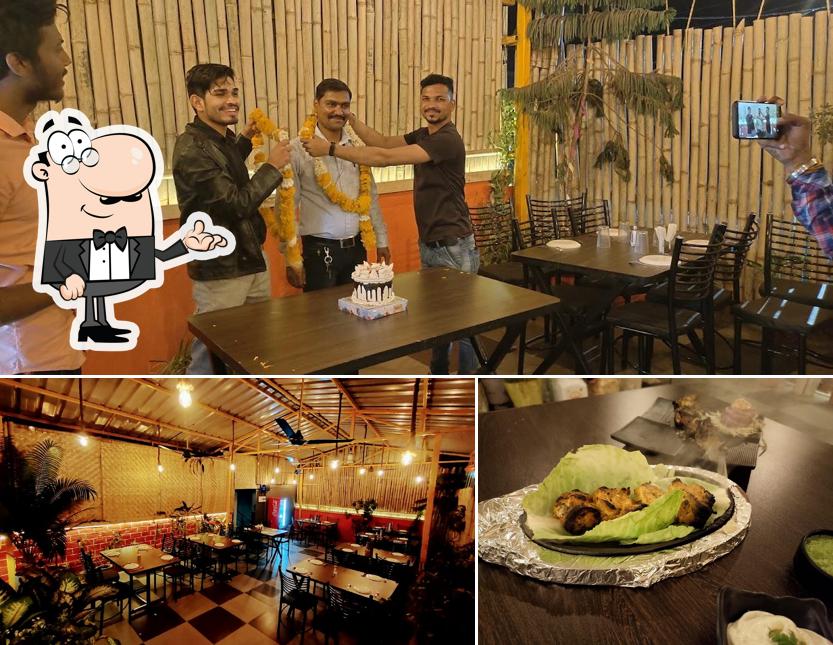 Take a look at the photo showing interior and food at Tandoor By Chef Anil