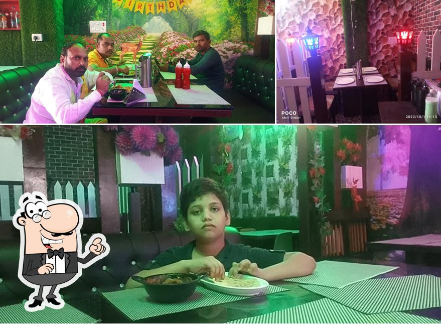 The photo of interior and beverage at Green chilli Restaurannt