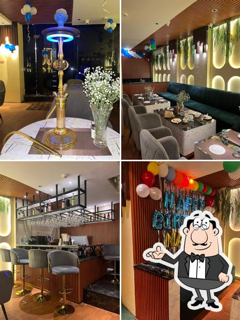 Take a seat at one of the tables at Three Guys Cafe And Lounge