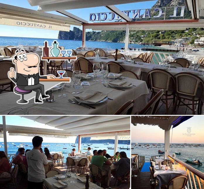 Dai un’occhiata alla foto che raffigura la interni e tavolo da pranzo di Ristorante Il Cantuccio Mare