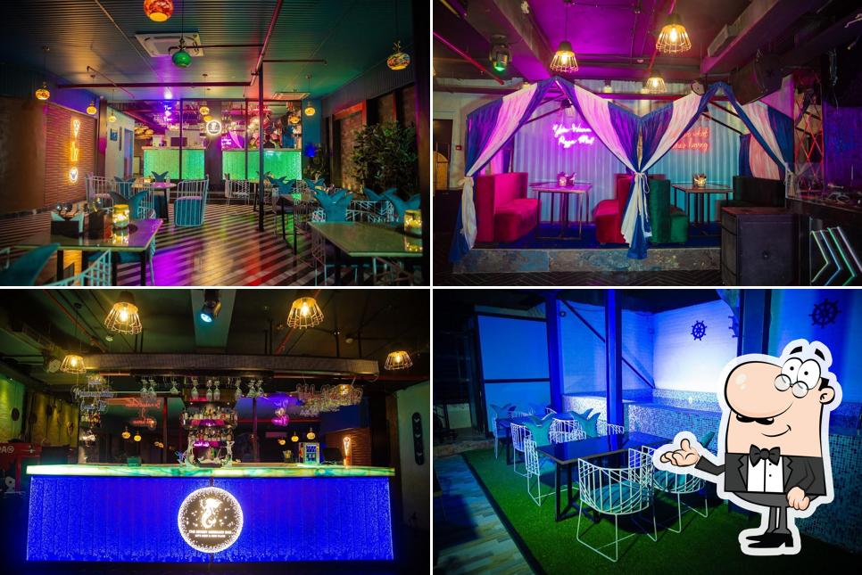 Take a seat at one of the tables at The Secret Mermaid Bar