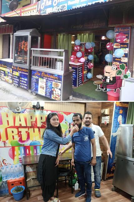 Take a seat at one of the tables at The Shakuntalam Family Restaurant