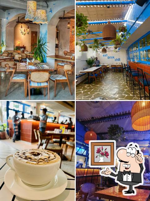 Take a seat at one of the tables at Cafe Holiday Versova