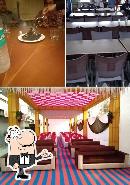 Take a seat at one of the tables at Shyam Kathiyawadi Dhaba