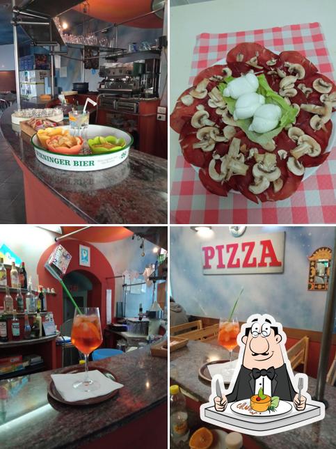 Questa è la immagine che raffigura la cibo e tavolo da pranzo di Le Voyage Pub