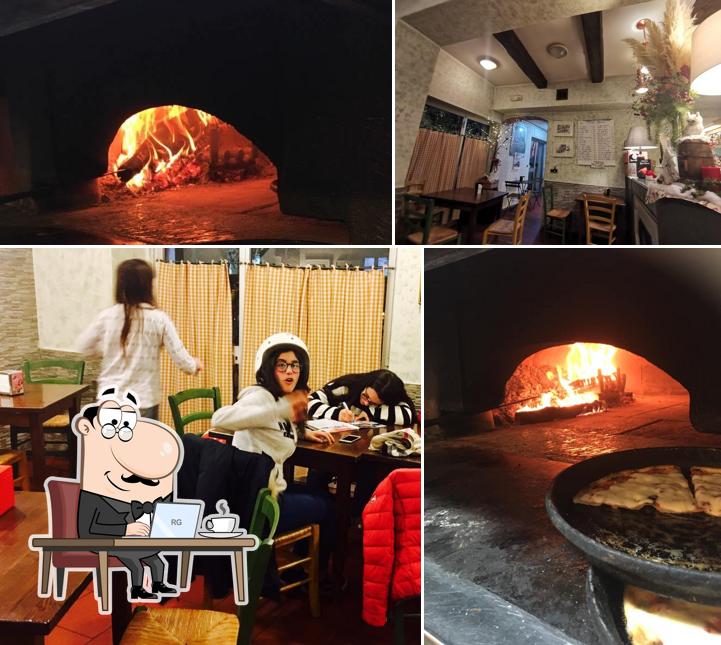 La interni e tavolo da pranzo del ristorante