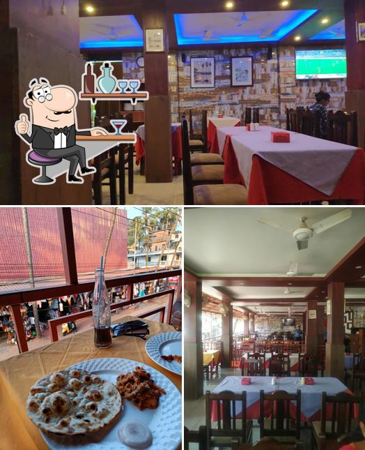 Take a seat at one of the tables at Alif Restaurant Capricorn Goa Restaurant