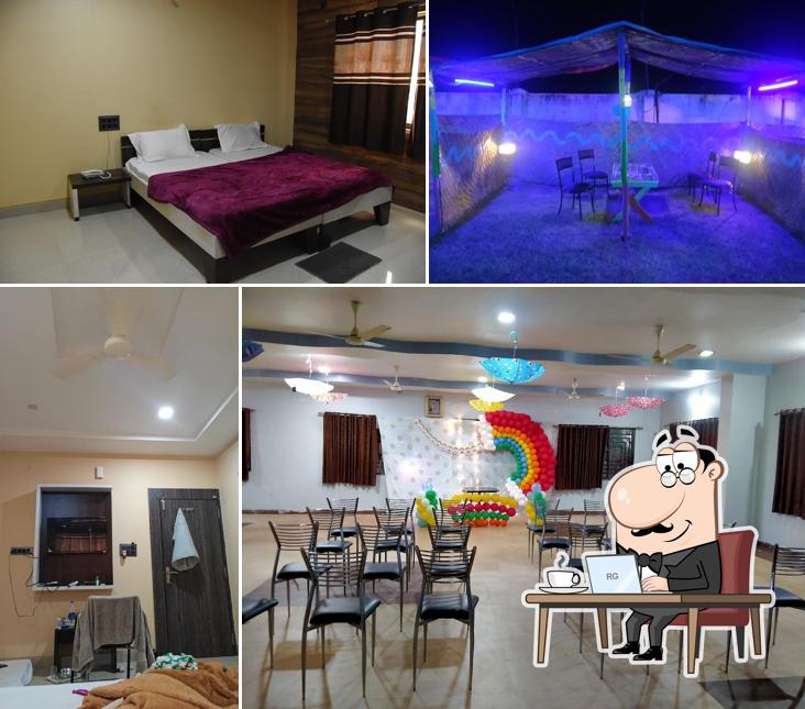 Take a seat at one of the tables at Hotel Sai Kripa Multai