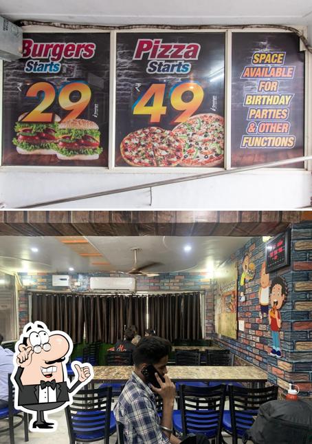 Take a seat at one of the tables at Dr. Deo'z Pizza & Cafe talwara